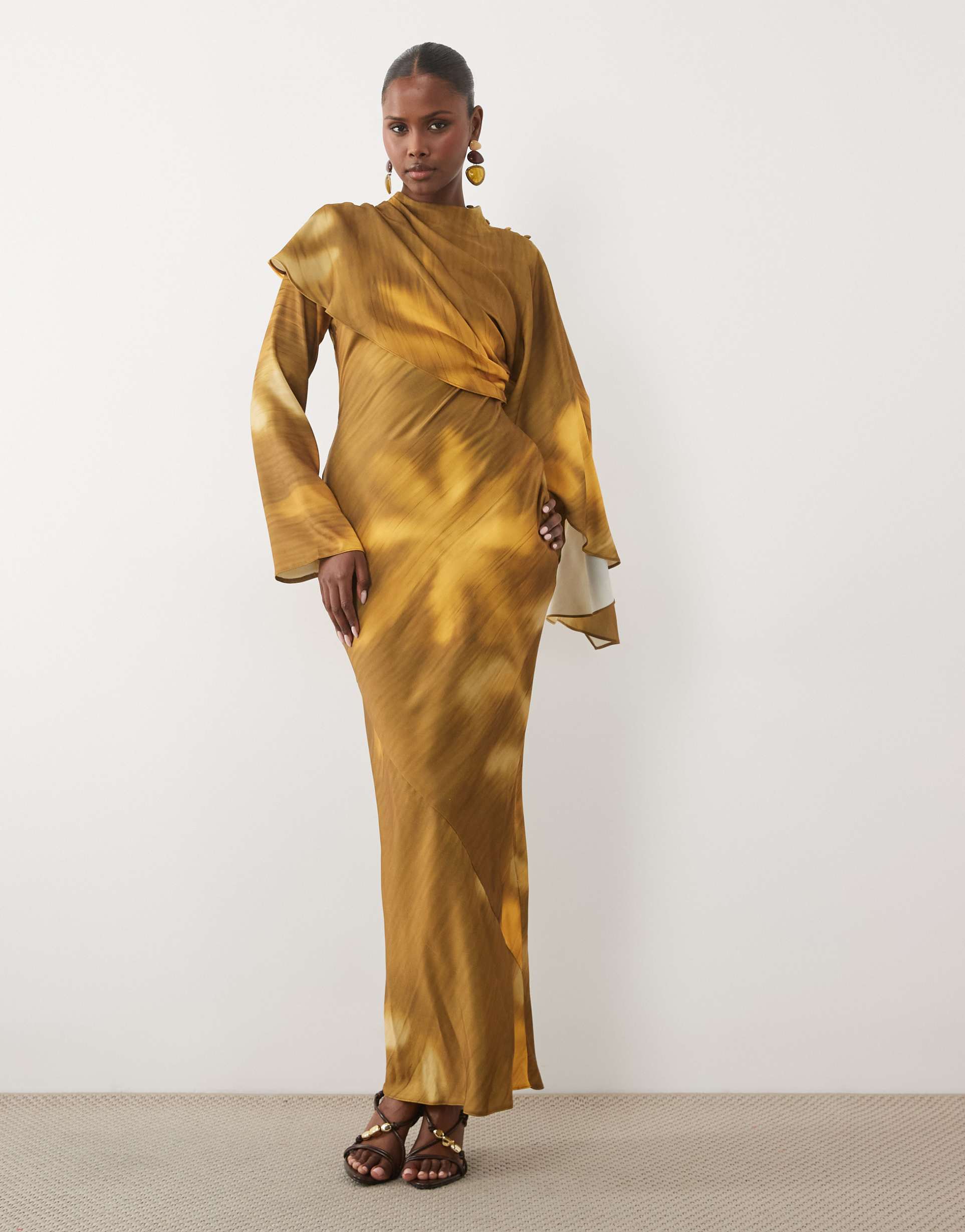 asos design asymmetric cape detail maxi dress with gathered waist in ochre & brown blurred floral print
