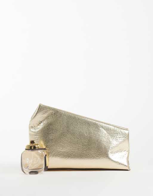 ASOS DESIGN asymmetric clutch in metallic gold, 2 of 4