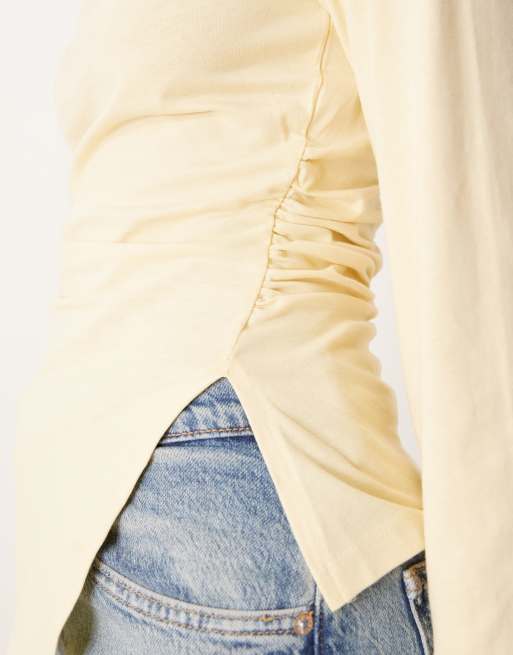 ASOS DESIGN asymmetric hem long sleeve ruched side top in yellow