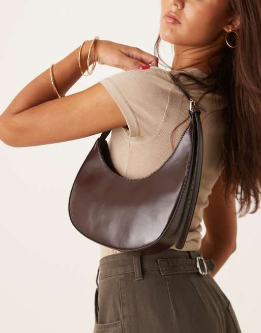 ASOS DESIGN asymmetric scoop shoulder bag with buckle detail in chocolate