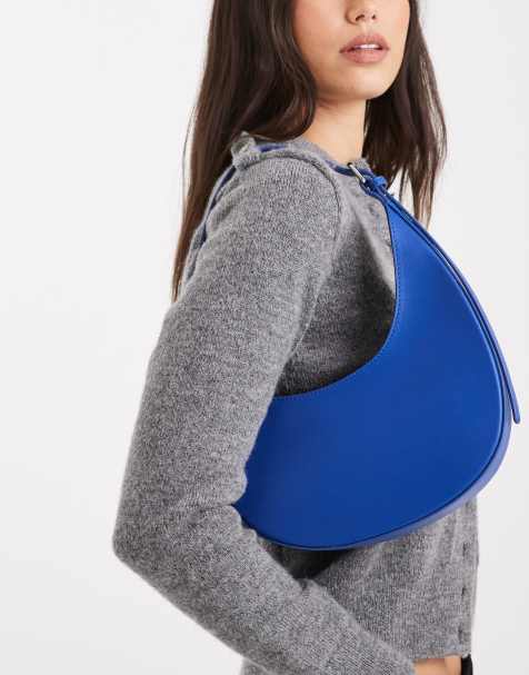 ASOS DESIGN asymmetric scoop shoulder bag with buckle detail in denim blue - view 1