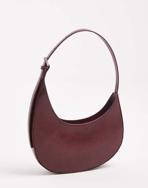 ASOS DESIGN asymmetric scoop shoulder bag with buckle detail in washed burgundy - view 1