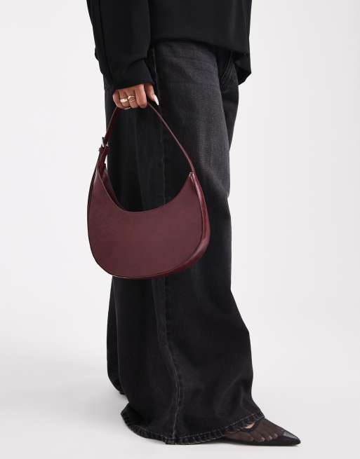 ASOS DESIGN asymmetric scoop shoulder bag with buckle detail in washed burgundy