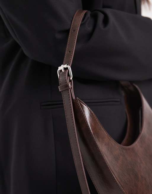 ASOS DESIGN asymmetric scoop shoulder bag with buckle detail in washed chocolate
