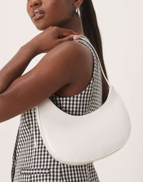 ASOS DESIGN asymmetric scoop shoulder bag with buckle detail in white - view 1