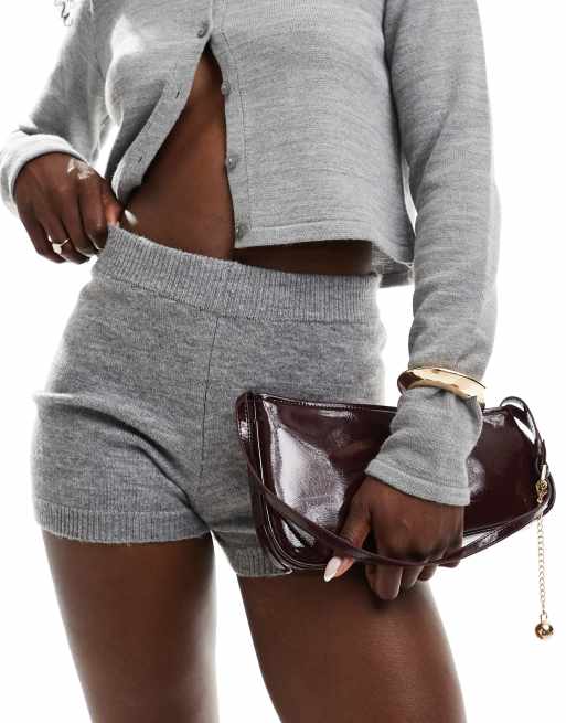 ASOS DESIGN asymmetric shoulder bag with buckle and removable ball charm in burgundy, 3 of 4