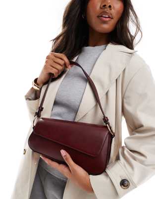 ASOS DESIGN asymmetric shoulder bag with front flap in burgundy-Red