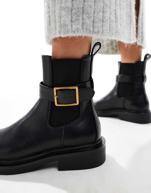 ASOS DESIGN Aurora flat boots with buckle strap in black