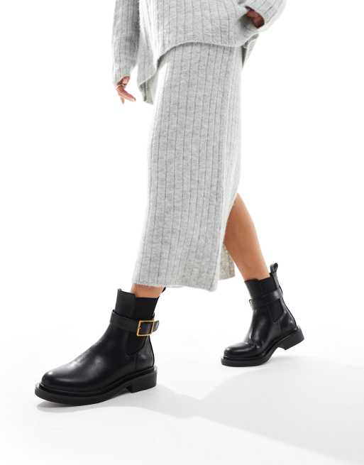 ASOS DESIGN Aurora flat boots with buckle strap in black ASOS