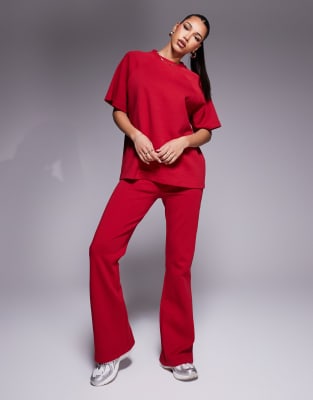 ASOS DESIGN - Ausgestellte Jogginghose aus Interlock-Stoff in Rot, Kombiteil