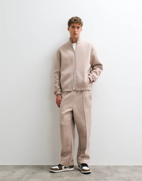 ASOS DESIGN avslappnade avsmalnande joggers i scuba-liknande tyg i neutral färg - view 1