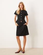 ASOS DESIGN short sleeve polo mini dress with pleated skirt in navy stripe