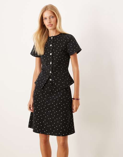 ASOS DESIGN awkward length denim skirt with mini polka dots