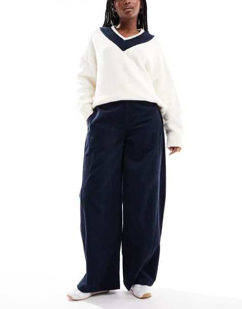 ASOS DESIGN baby cord extreme horseshoe trousers with seam detail in navy - view 1