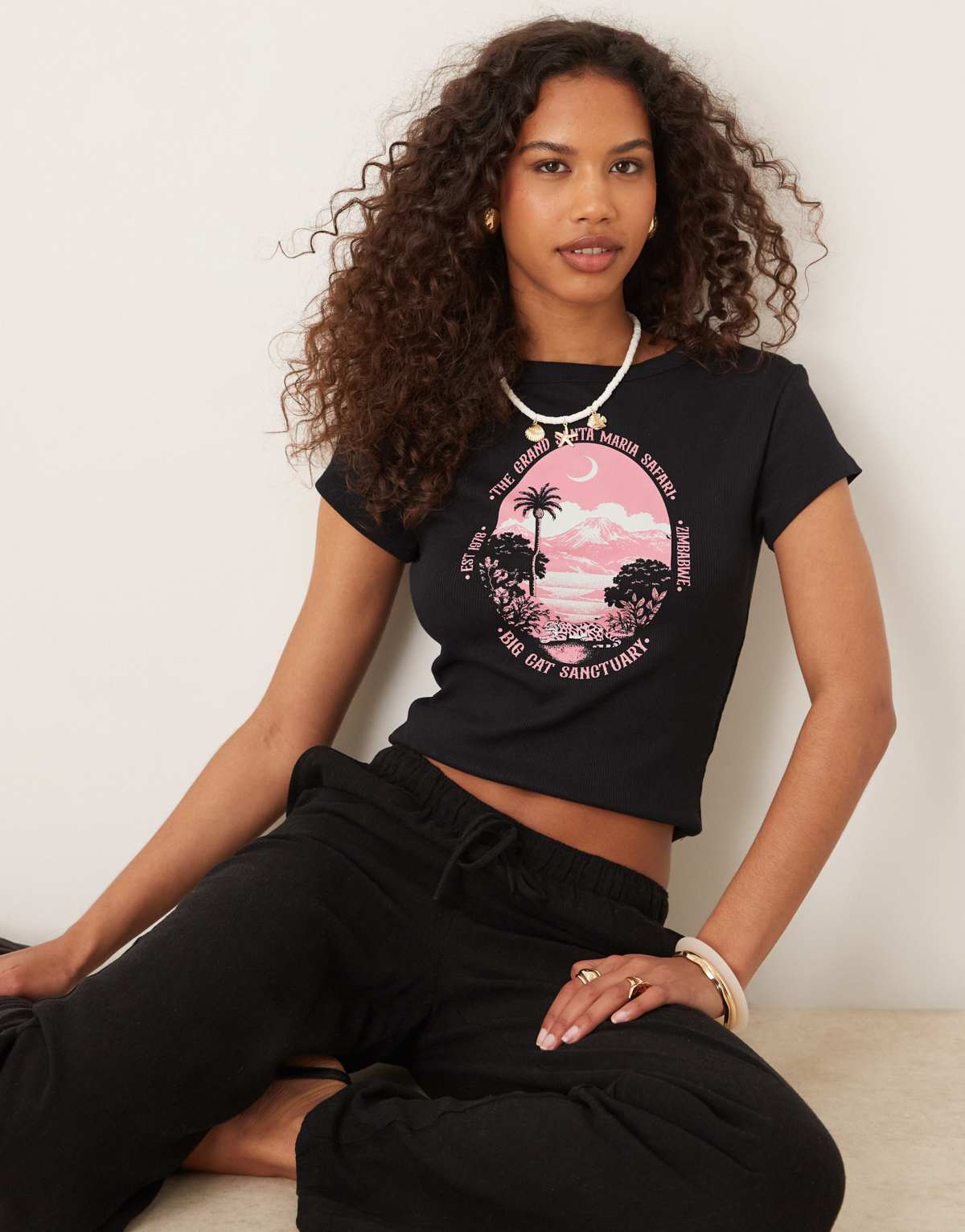 ASOS DESIGN baby tee with pink safari graphic in black