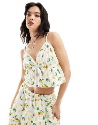 ASOS DESIGN - Babydoll-Camisole mit Lochstickerei und Zitronenmuster, Kombiteil-Bunt