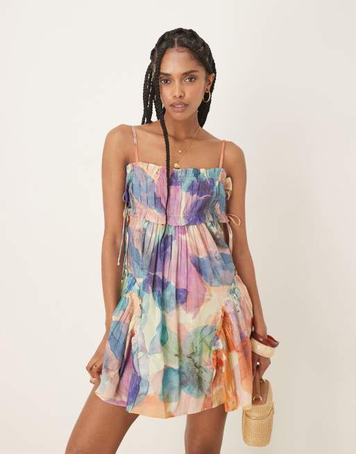 ASOS DESIGN babydoll mini dress with ruffle hem in blurred floral print