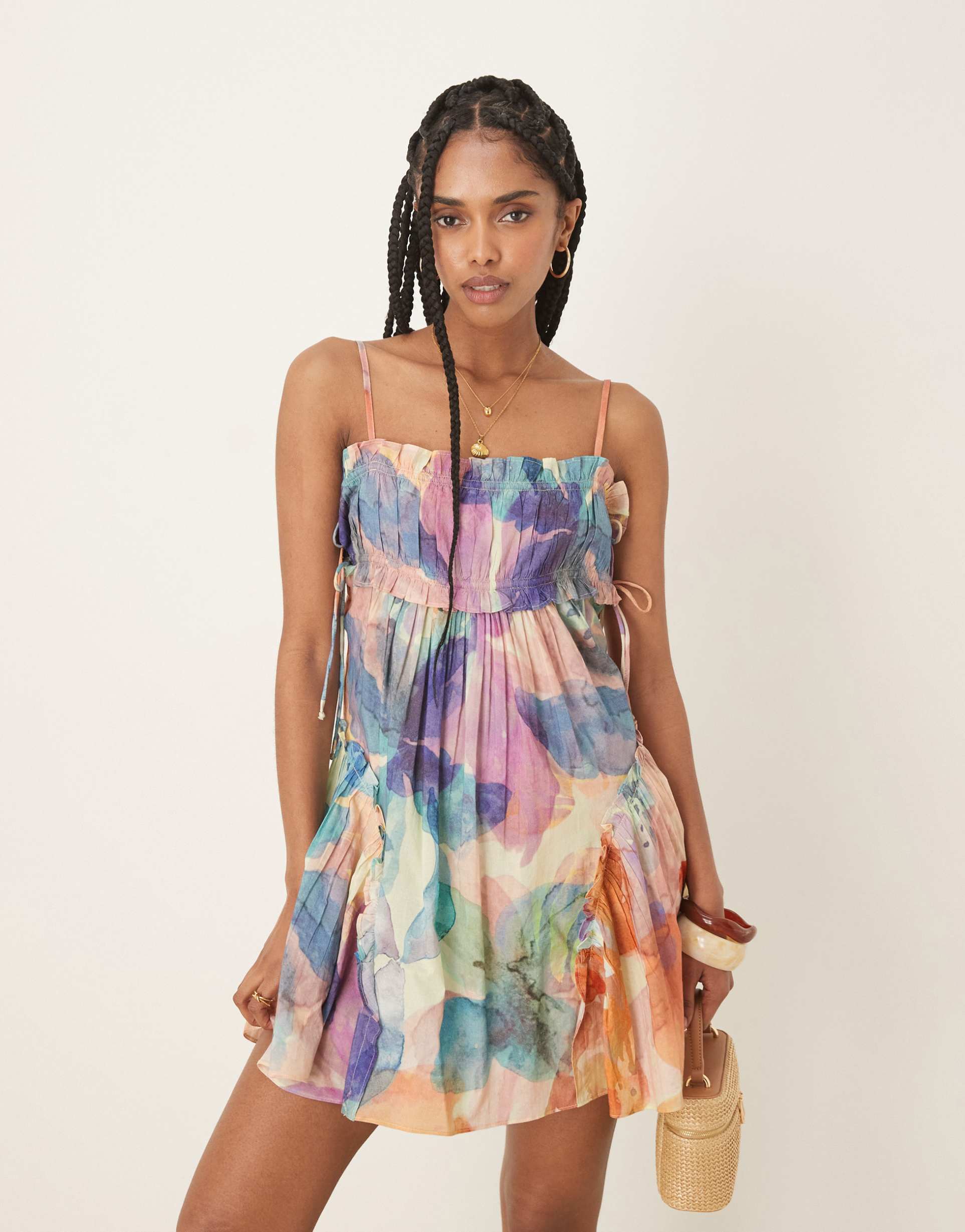 asos design babydoll mini dress with ruffle hem in blurred floral print