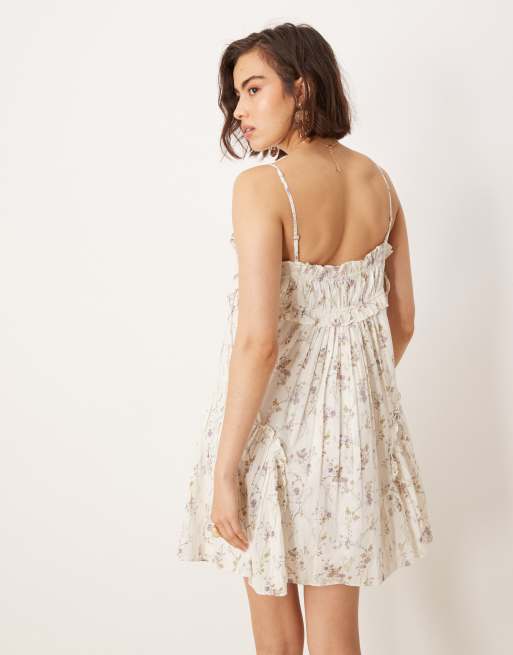ASOS DESIGN babydoll mini dress with ruffle hem in ditsy floral print