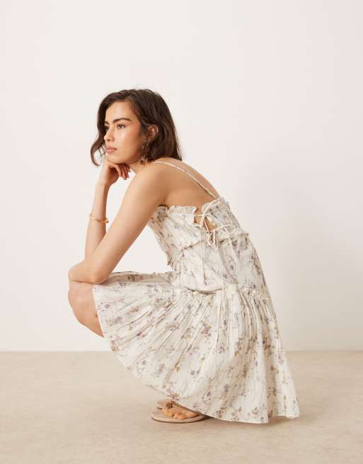 ASOS DESIGN babydoll mini dress with ruffle hem in ditsy floral print