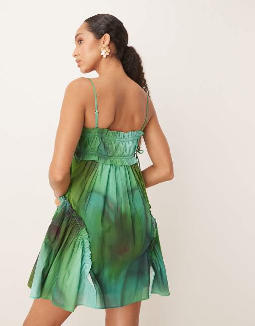 ASOS DESIGN babydoll mini dress with ruffle hem in green blurred print