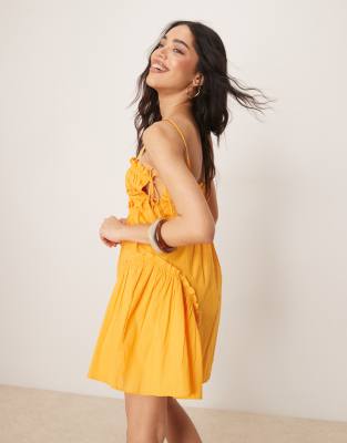 ASOS DESIGN babydoll mini dress with ruffle hem in orange