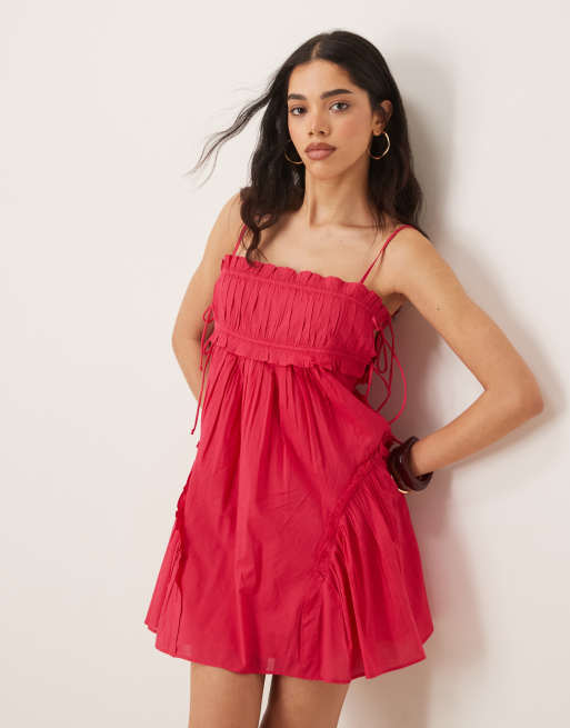 ASOS DESIGN babydoll mini dress with ruffle hem in raspberry