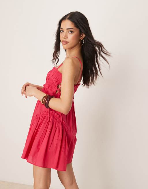 ASOS DESIGN babydoll mini dress with ruffle hem in raspberry