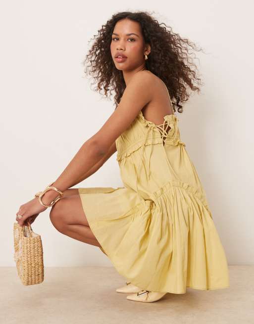 ASOS DESIGN babydoll mini dress with ruffle hem in washed lime