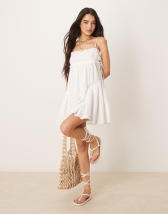 ASOS DESIGN bandeau mini swing dress in pink blurred print