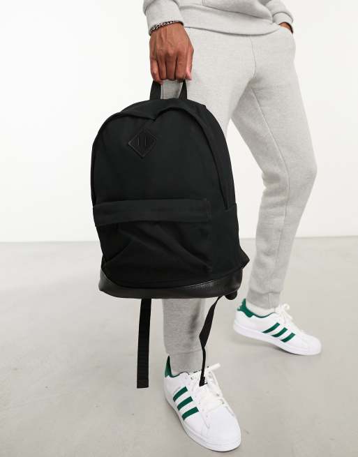 ASOS DESIGN backpack in black canvas and faux leather ASOS