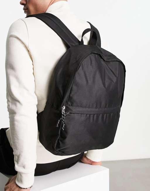 Mochila negra de lona con base de cuero sintético de ASOS DESIGN