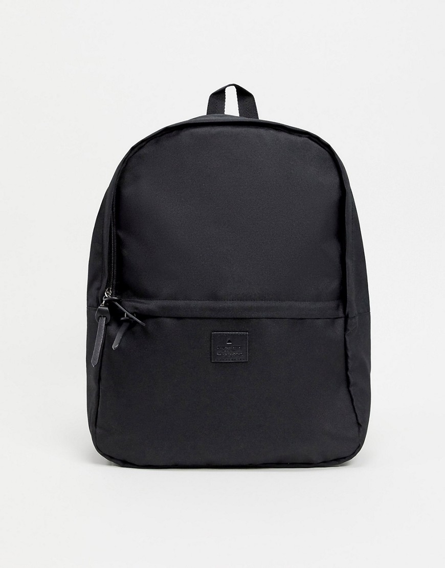 ASOS DESIGN backpack in black with branded patch