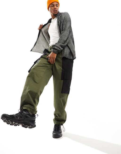 ASOS DESIGN baggy cargo pants in khaki and black color block and belt  detail in nylon