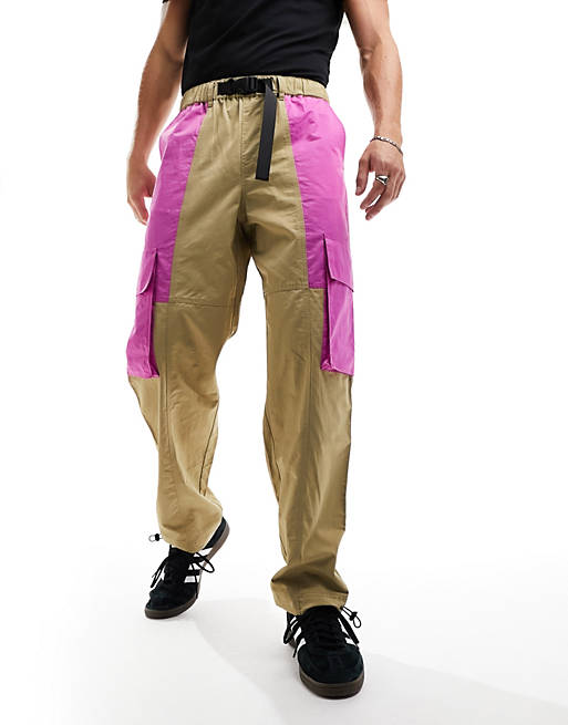 ASOS DESIGN baggy cargo pants in tan and pink with webbing belt