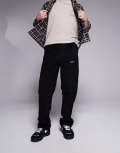 [ASOS DESIGN] ASOS DESIGN baggy cord pants with embroidered patch in black W28 L32 BLACK
