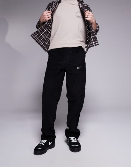 ASOS DESIGN baggy cord pants with embroidered patch in black 