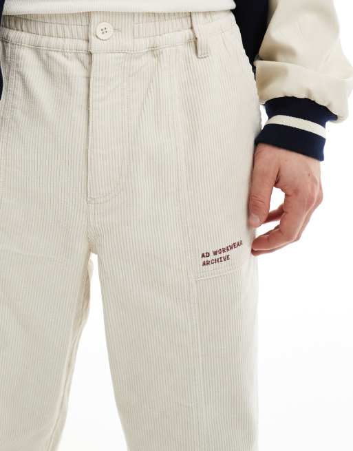 ASOS DESIGN baggy cord pants with embroidered patch in stone 