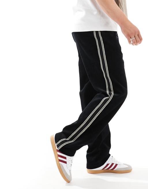 ASOS DESIGN baggy cord trousers with side taping in black 