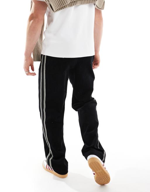 ASOS DESIGN baggy cord trousers with side taping in black 
