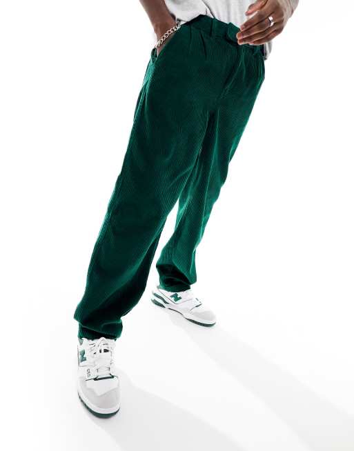 ASOS DESIGN relaxed cargo pants in dark green cord