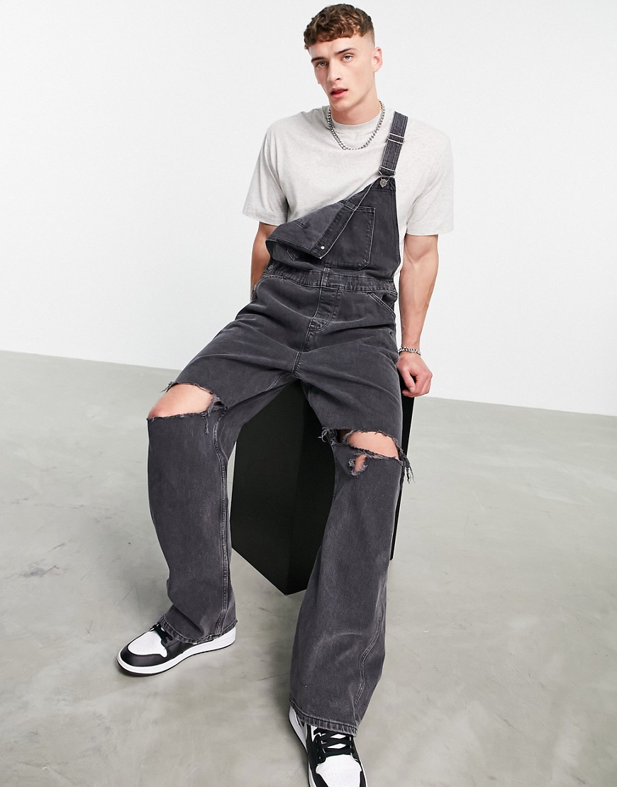 ASOS DESIGN baggy denim dungarees in washed black with knee rips