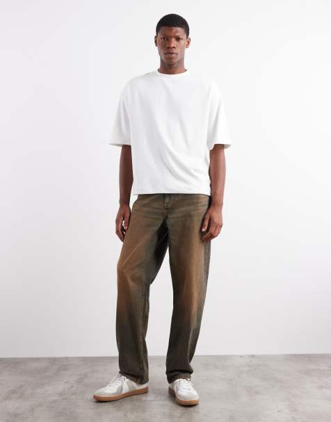 ASOS DESIGN baggy fit jeans in mid wash blue with brown tint - view 1