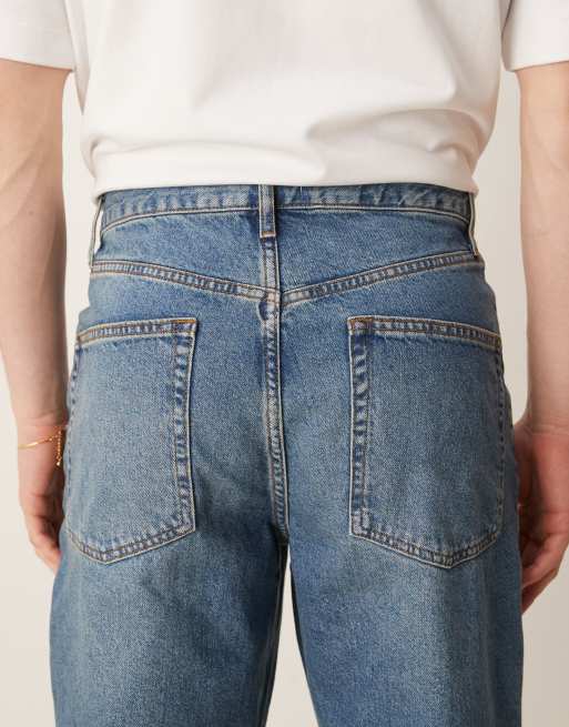 ASOS DESIGN baggy fit jeans in mid wash blue