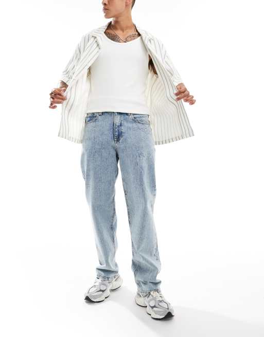 ASOS DESIGN baggy fit jeans with heavy acid wash in light wash blue  , 2 of 5