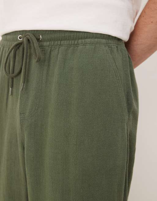 ASOS DESIGN baggy fit pull on linen mix pants in dark green 