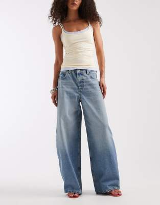 ASOS DESIGN baggy horseshoe jeans in light mid wash
