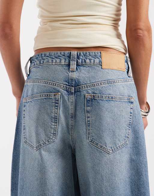 ASOS DESIGN baggy horseshoe jeans in light mid wash, 4 of 5