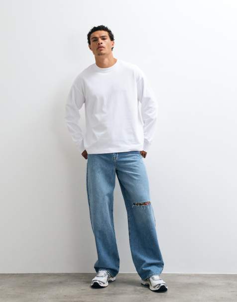 ASOS DESIGN Baggy-Jeans in hellblauer Waschung mit Rissen - view 1