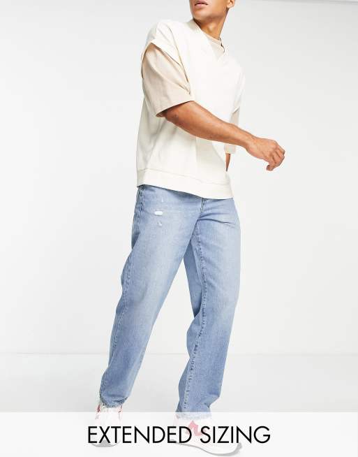 ASOS DESIGN baggy jeans in mid wash blue with abrasions